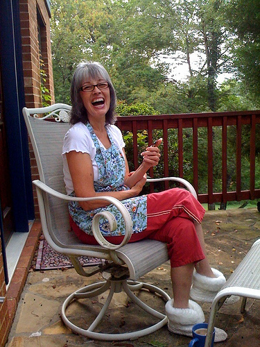 Mom playing Words With Friends on her iPod Touch on the front porch